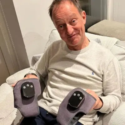 Old man reviewing Orthocare foot massager